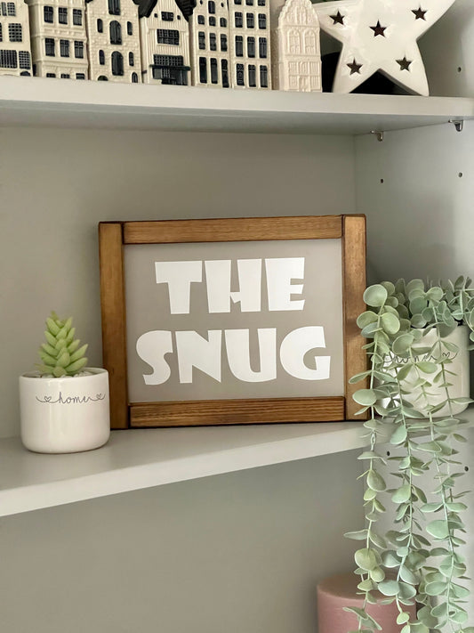 The Snug Wooden Sign.